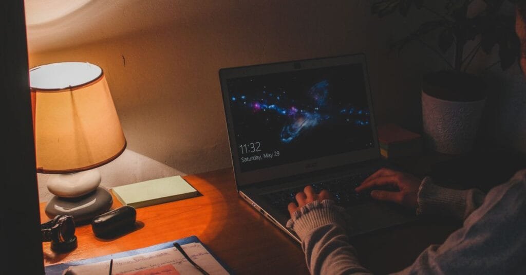 Person working on a laptop late at night