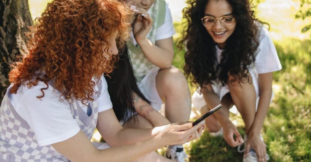 Friends looking at a smartphone