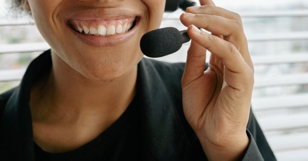 Support agent smiling with a headset