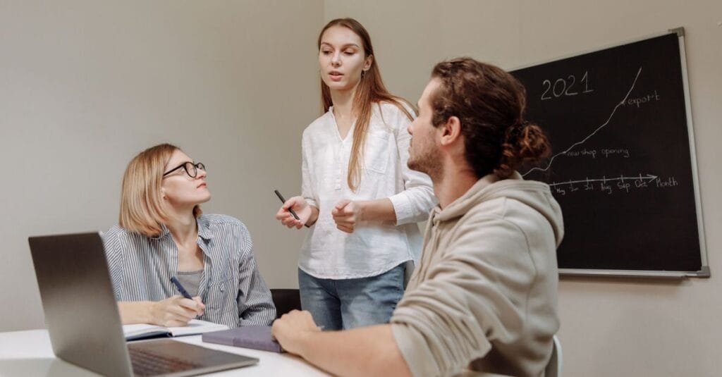 Small team planning around a growth chart