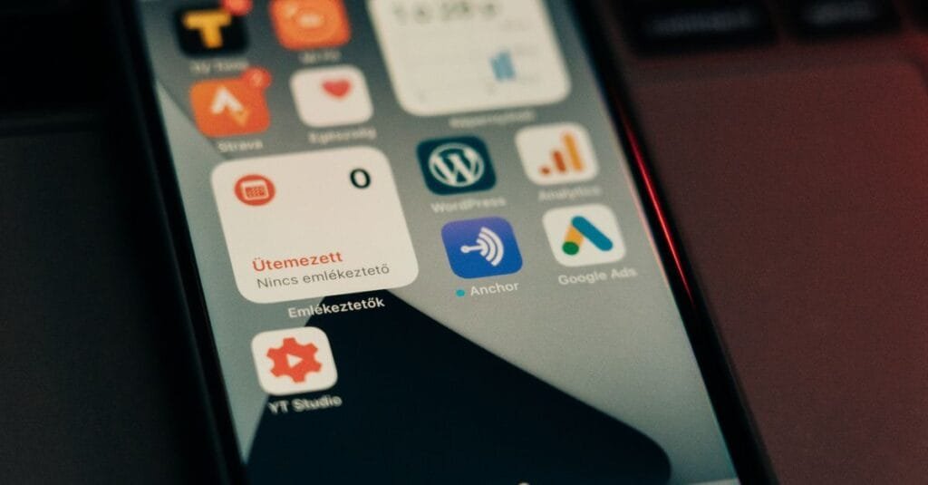 Phone showing app icons including ads